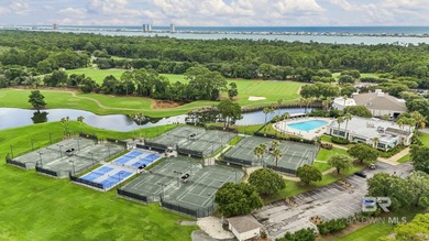 Elevate your vision of paradise in this stunning, 4BR/4BA on Peninsula Golf and Racquet Club in Alabama - for sale on GolfHomes.com, golf home, golf lot