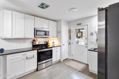 Welcome to this beautifully updated 2-bedroom, 1-bath attached on Greenbriar Woodlands in New Jersey - for sale on GolfHomes.com, golf home, golf lot