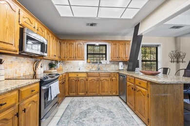 This home delivers immediate curb appeal with a generous front on Hide-A-Way Lake Golf Course in Texas - for sale on GolfHomes.com, golf home, golf lot