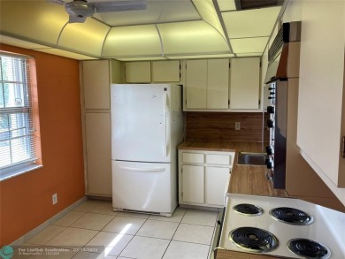 Opportunity knocks with this spacious F unit in Palm Aire on Oaks Country Club in Florida - for sale on GolfHomes.com, golf home, golf lot