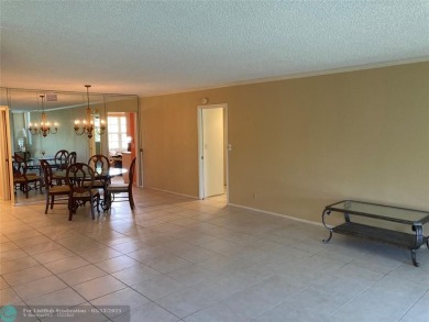 Opportunity knocks with this spacious F unit in Palm Aire on Oaks Country Club in Florida - for sale on GolfHomes.com, golf home, golf lot