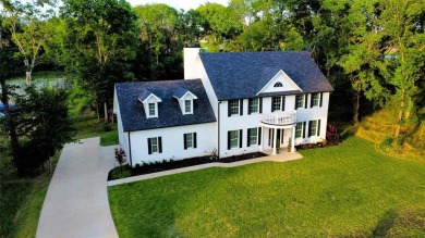 Colonial house adjacent to the golf course with lake view and on Cedar Creek Country Club in Texas - for sale on GolfHomes.com, golf home, golf lot