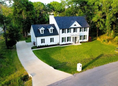 Colonial house adjacent to the golf course with lake view and on Cedar Creek Country Club in Texas - for sale on GolfHomes.com, golf home, golf lot