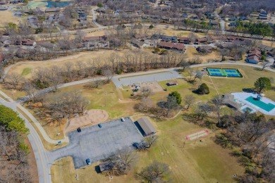 Enjoy stunning golf-front views of the #5 Fairway from the front on Bella Vista - Metfield Golf Complex and Country Club in Arkansas - for sale on GolfHomes.com, golf home, golf lot