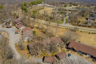 Enjoy stunning golf-front views of the #5 Fairway from the front on Bella Vista - Metfield Golf Complex and Country Club in Arkansas - for sale on GolfHomes.com, golf home, golf lot