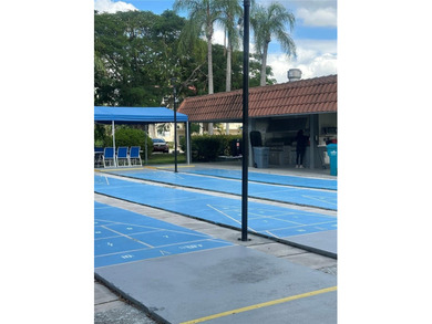 Enjoy relaxing garden  views from your screened in porch. The on Hollybrook Golf and Tennis Club  in Florida - for sale on GolfHomes.com, golf home, golf lot