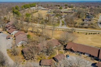 Enjoy stunning golf-front views of the #5 Fairway from the front on Bella Vista - Metfield Golf Complex and Country Club in Arkansas - for sale on GolfHomes.com, golf home, golf lot