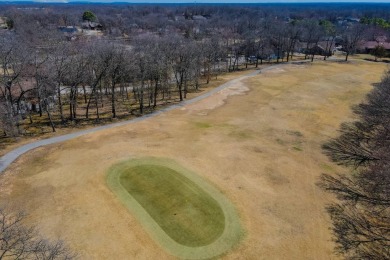 Enjoy stunning golf-front views of the #5 Fairway from the front on Bella Vista - Metfield Golf Complex and Country Club in Arkansas - for sale on GolfHomes.com, golf home, golf lot