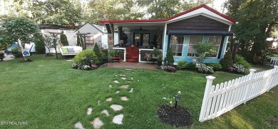 Lovely Cottage style living with 2 bedrooms, 2.5 baths! You must on Lake Tansi Village Country Club in Tennessee - for sale on GolfHomes.com, golf home, golf lot