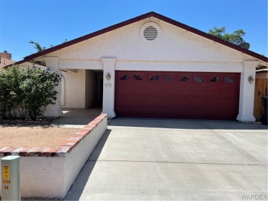 This house is just one and a half Blocks from a beautiful golf on Cerbat Cliffs Golf Course in Arizona - for sale on GolfHomes.com, golf home, golf lot