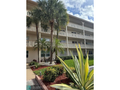 Do not miss this desirable FIRST floor corner unit. This unit is on Wynmoor Golf Course in Florida - for sale on GolfHomes.com, golf home, golf lot
