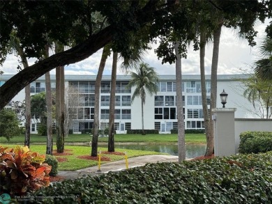 Do not miss this desirable FIRST floor corner unit. This unit is on Wynmoor Golf Course in Florida - for sale on GolfHomes.com, golf home, golf lot