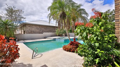 Contemporary, two story brick home has elegance and style on Spruce Creek Golf Club in Florida - for sale on GolfHomes.com, golf home, golf lot