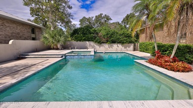 Contemporary, two story brick home has elegance and style on Spruce Creek Golf Club in Florida - for sale on GolfHomes.com, golf home, golf lot