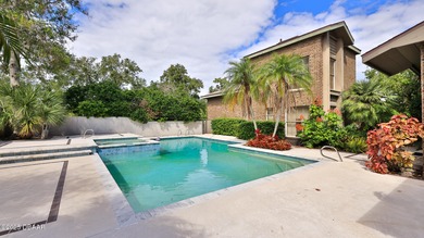 Contemporary, two story brick home has elegance and style on Spruce Creek Golf Club in Florida - for sale on GolfHomes.com, golf home, golf lot