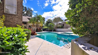 Contemporary, two story brick home has elegance and style on Spruce Creek Golf Club in Florida - for sale on GolfHomes.com, golf home, golf lot