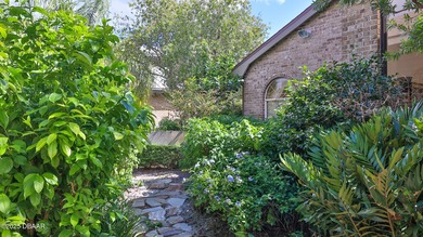 Contemporary, two story brick home has elegance and style on Spruce Creek Golf Club in Florida - for sale on GolfHomes.com, golf home, golf lot