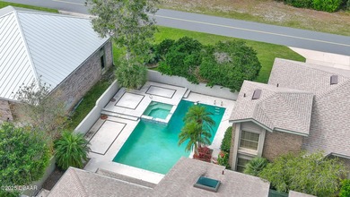 Contemporary, two story brick home has elegance and style on Spruce Creek Golf Club in Florida - for sale on GolfHomes.com, golf home, golf lot