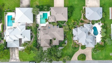 Contemporary, two story brick home has elegance and style on Spruce Creek Golf Club in Florida - for sale on GolfHomes.com, golf home, golf lot