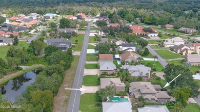 Contemporary, two story brick home has elegance and style on Spruce Creek Golf Club in Florida - for sale on GolfHomes.com, golf home, golf lot