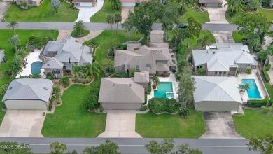 Contemporary, two story brick home has elegance and style on Spruce Creek Golf Club in Florida - for sale on GolfHomes.com, golf home, golf lot