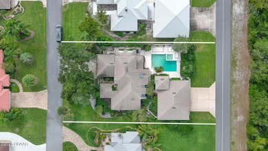 Contemporary, two story brick home has elegance and style on Spruce Creek Golf Club in Florida - for sale on GolfHomes.com, golf home, golf lot