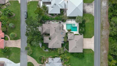 Contemporary, two story brick home has elegance and style on Spruce Creek Golf Club in Florida - for sale on GolfHomes.com, golf home, golf lot