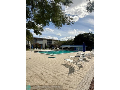 Do not miss this desirable FIRST floor corner unit. This unit is on Wynmoor Golf Course in Florida - for sale on GolfHomes.com, golf home, golf lot