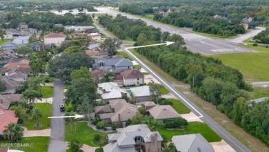 Contemporary, two story brick home has elegance and style on Spruce Creek Golf Club in Florida - for sale on GolfHomes.com, golf home, golf lot