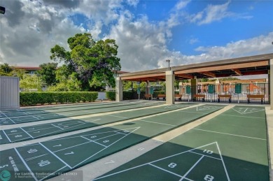 Do not miss this desirable FIRST floor corner unit. This unit is on Wynmoor Golf Course in Florida - for sale on GolfHomes.com, golf home, golf lot