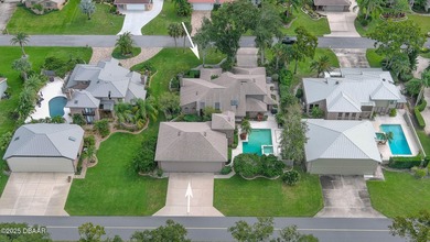 Contemporary, two story brick home has elegance and style on Spruce Creek Golf Club in Florida - for sale on GolfHomes.com, golf home, golf lot
