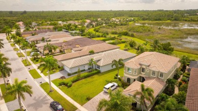 This 2022 built home sits on the preserve with incredible views on Ibis Golf and Country Club in Florida - for sale on GolfHomes.com, golf home, golf lot