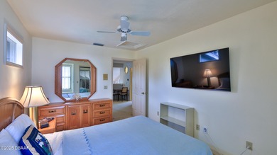 Contemporary, two story brick home has elegance and style on Spruce Creek Golf Club in Florida - for sale on GolfHomes.com, golf home, golf lot