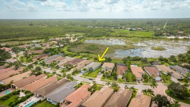 This 2022 built home sits on the preserve with incredible views on Ibis Golf and Country Club in Florida - for sale on GolfHomes.com, golf home, golf lot