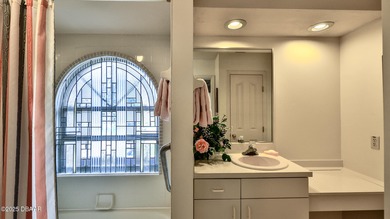 Contemporary, two story brick home has elegance and style on Spruce Creek Golf Club in Florida - for sale on GolfHomes.com, golf home, golf lot