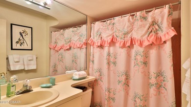 Contemporary, two story brick home has elegance and style on Spruce Creek Golf Club in Florida - for sale on GolfHomes.com, golf home, golf lot