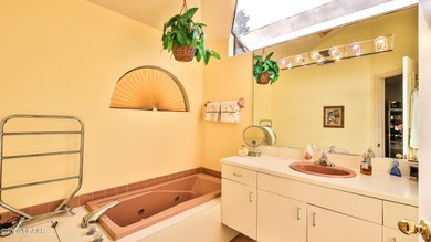 Contemporary, two story brick home has elegance and style on Spruce Creek Golf Club in Florida - for sale on GolfHomes.com, golf home, golf lot