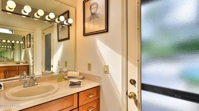 Contemporary, two story brick home has elegance and style on Spruce Creek Golf Club in Florida - for sale on GolfHomes.com, golf home, golf lot