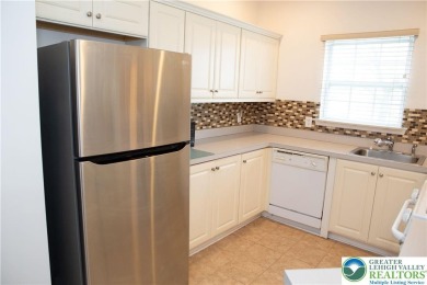 First floor end unit 2 bedroom, 2 bath condo with no stairs on The Club At Morgan Hill in Pennsylvania - for sale on GolfHomes.com, golf home, golf lot