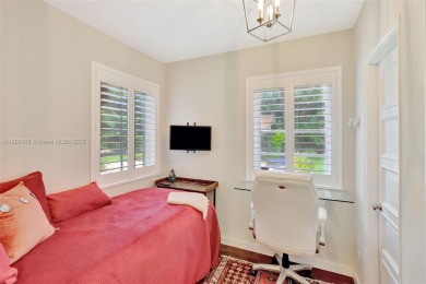 Set on an oversized 17,100-square-foot lot, nestled just around on Granada Golf Club in Florida - for sale on GolfHomes.com, golf home, golf lot
