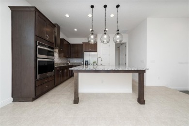 Stunning Move-In Ready Townhome in the Prestigious Gated on Eagle Creek Golf Club in Florida - for sale on GolfHomes.com, golf home, golf lot