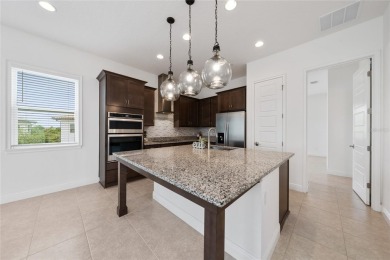 Stunning Move-In Ready Townhome in the Prestigious Gated on Eagle Creek Golf Club in Florida - for sale on GolfHomes.com, golf home, golf lot