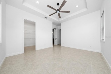Stunning Move-In Ready Townhome in the Prestigious Gated on Eagle Creek Golf Club in Florida - for sale on GolfHomes.com, golf home, golf lot
