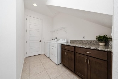 Stunning Move-In Ready Townhome in the Prestigious Gated on Eagle Creek Golf Club in Florida - for sale on GolfHomes.com, golf home, golf lot