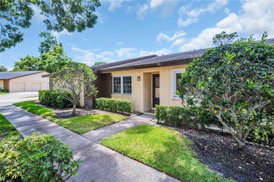 This spacious end-unit villa with serene golf course views is on Highland Lakes Executive Golf Course in Florida - for sale on GolfHomes.com, golf home, golf lot