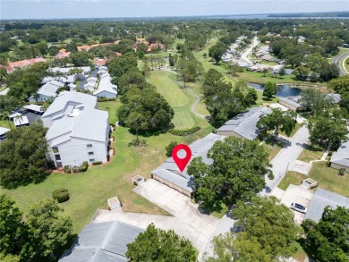This spacious end-unit villa with serene golf course views is on Highland Lakes Executive Golf Course in Florida - for sale on GolfHomes.com, golf home, golf lot