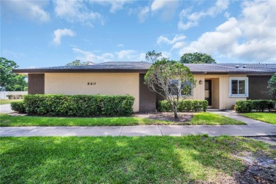 This spacious end-unit villa with serene golf course views is on Highland Lakes Executive Golf Course in Florida - for sale on GolfHomes.com, golf home, golf lot