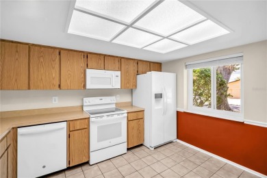 This spacious end-unit villa with serene golf course views is on Highland Lakes Executive Golf Course in Florida - for sale on GolfHomes.com, golf home, golf lot