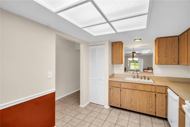 This spacious end-unit villa with serene golf course views is on Highland Lakes Executive Golf Course in Florida - for sale on GolfHomes.com, golf home, golf lot