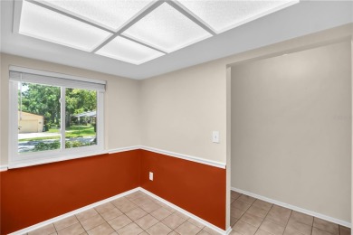 This spacious end-unit villa with serene golf course views is on Highland Lakes Executive Golf Course in Florida - for sale on GolfHomes.com, golf home, golf lot